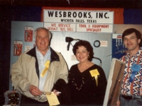 Mike Grauerholz of Wesbrooks, Inc. presenting a rifle at the 1992 NAIL Quick Lube Show in New Orleans.